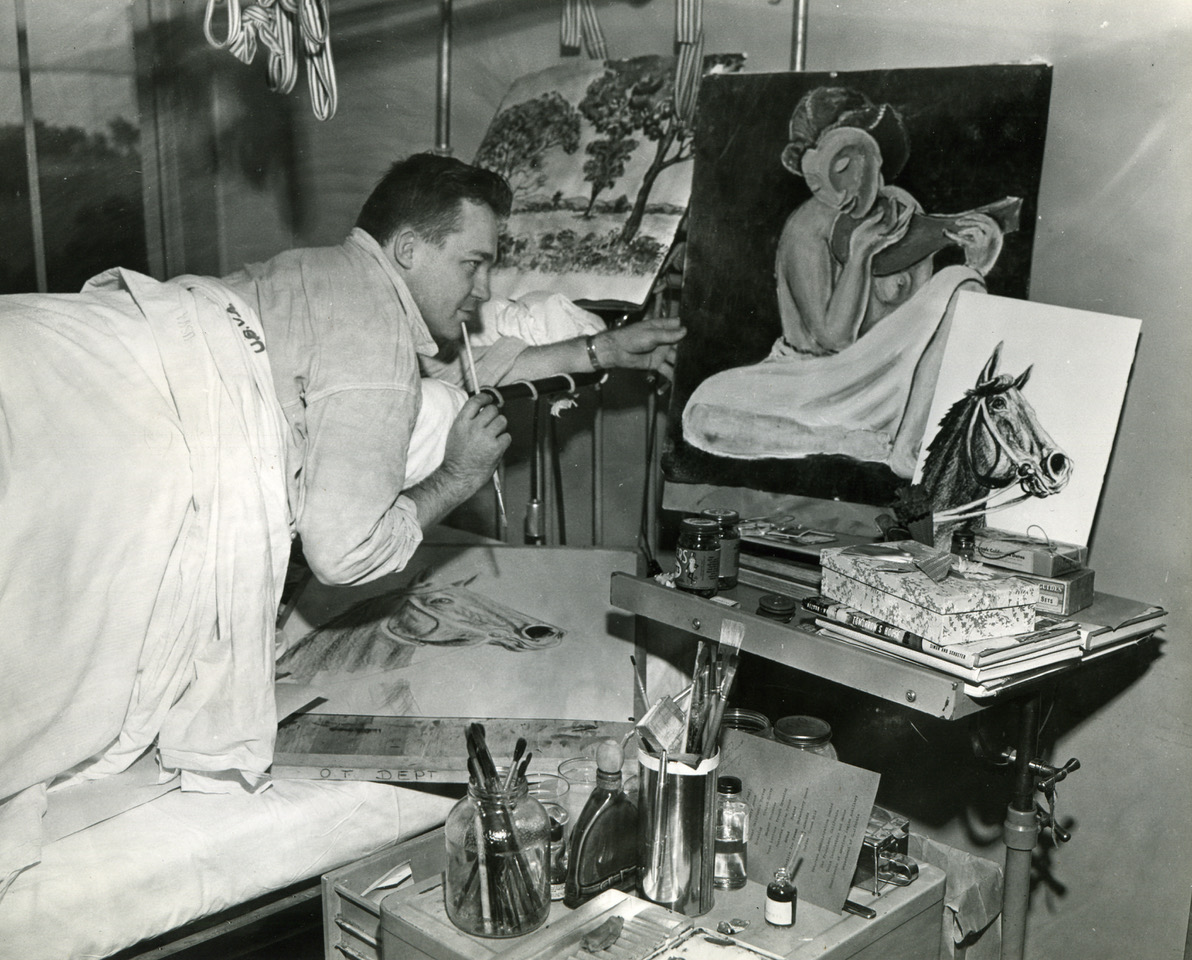 Newspaper photo of Francis painting in the \"Bradford frame\" hoisted above hospital bed at Fort Miley, March 18, 1946; photo by Acme, San Francisco Bureau.